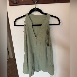 Sage green sleeveless blouse with lace trim detail